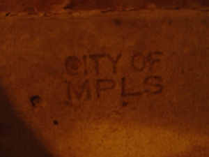 Stamped into the sidewalk on 11th & La Salle